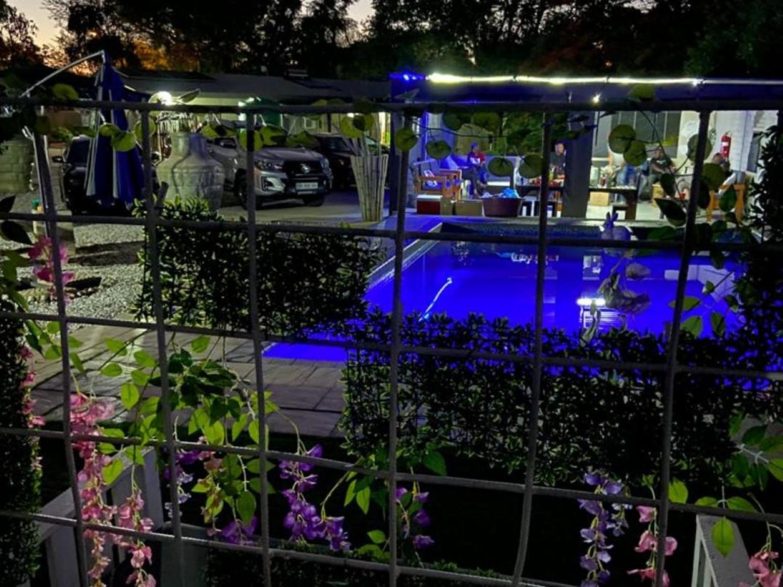 Pool area at Monet Guesthouse at night
